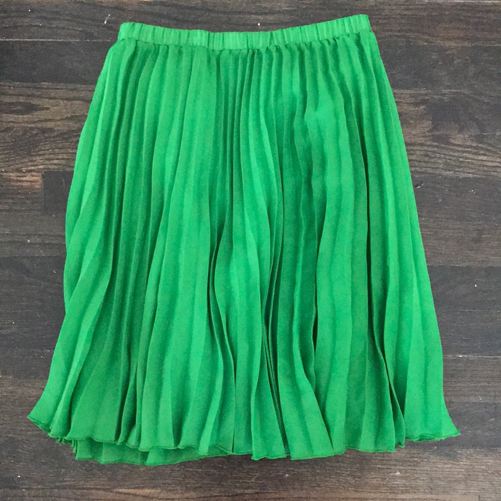 Bright green pleated knee length skirt